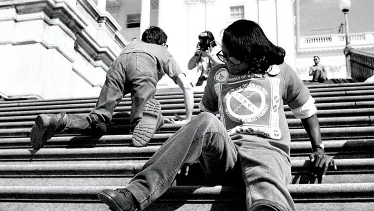 People with disabilities crawl up the Capitol steps in 1972.